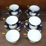 A set of six Royal Crown Derby Vine Cobalt tea cups, saucers and tea plates