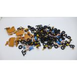 A collection of reproduction tyres and figure parts for vintage Dinky and Corgi models