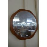 A teak framed mirror