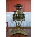 A Victorian Aesthetic Movement brass oil lamp, manner of W.A.S. Benson