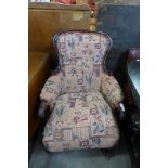 A Victorian mahogany and fabric upholstered armchair
