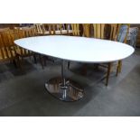 An Eero Saarinen style chrome based table