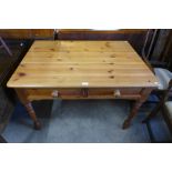 A pine two drawer kitchen table