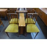 A teak drop-leaf table and four chairs