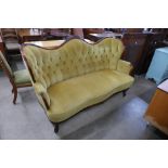 A French carved mahogany and fabric upholstered button back settee