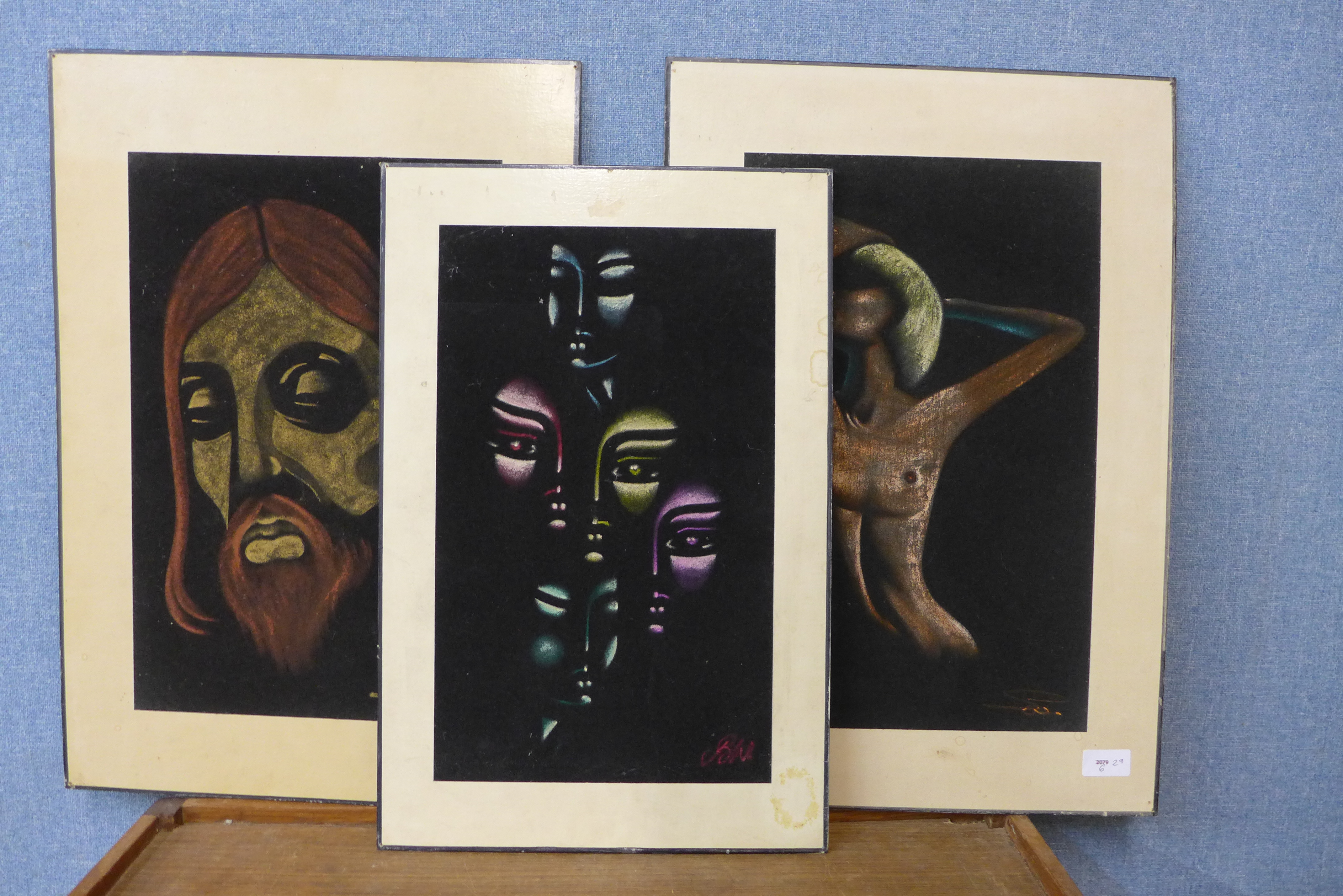 Three African School pastel on felt portraits, all indistinctly signed