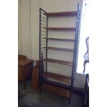 A teak and black metal Ladderax room divider with extra shelving