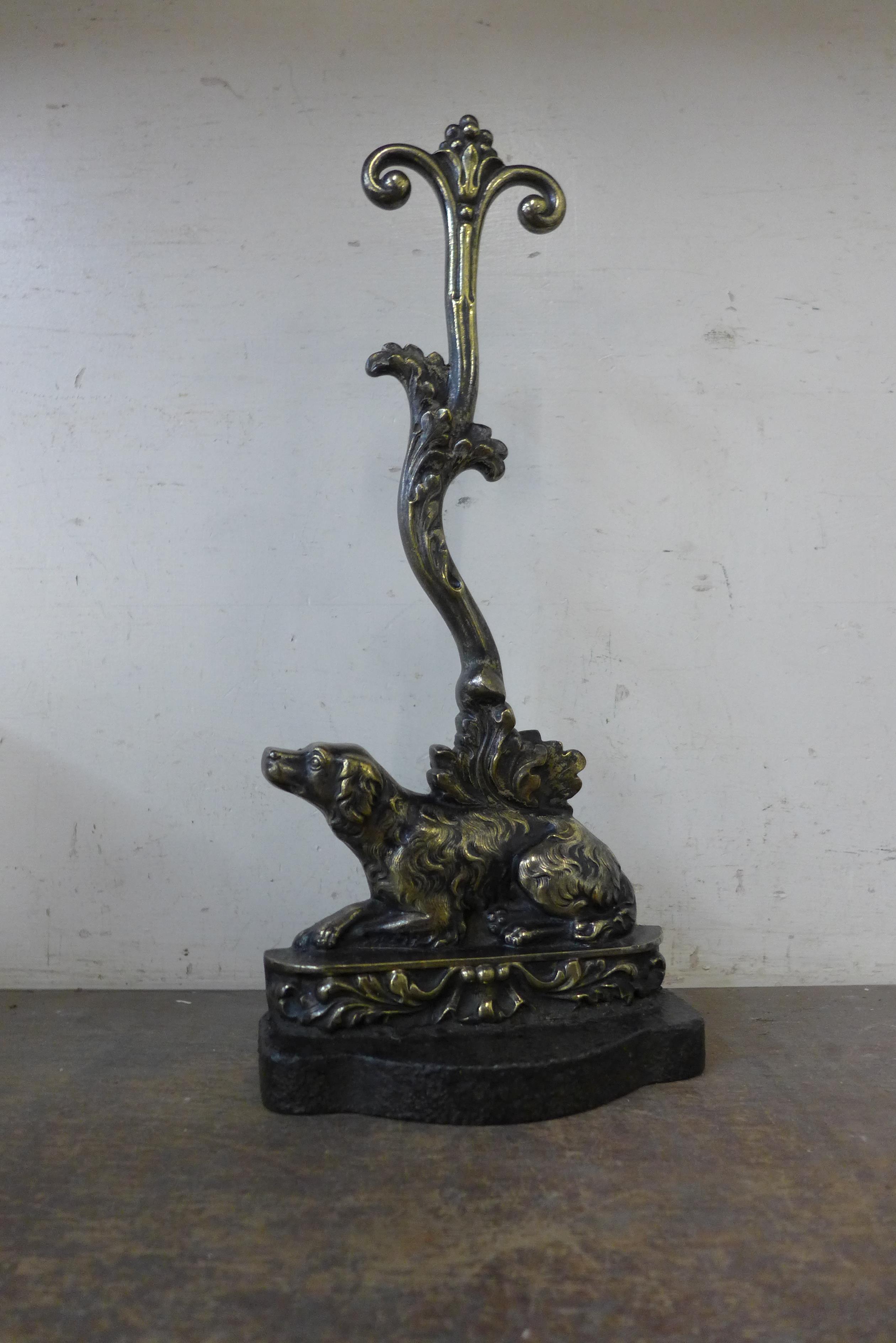 A Victorian brass spaniel door stop