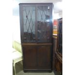 A George III inlaid mahogany corner cabinet