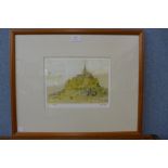 A limited edition print of Mont St. Michel, framed