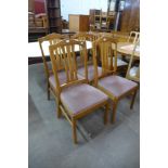 A set of four teak dining chairs