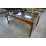 A teak and glass top coffee table