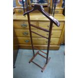 A teak gentleman's valet stand