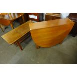 A teak coffee table and a teak drop leaf table