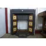 A Victorian tiled and cast iron fire surround