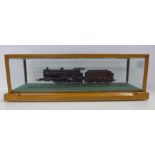 A model LMS compound locomotive and tender with display case