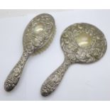 A silver backed mirror and brush