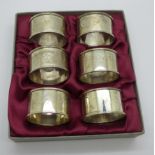 A boxed set of six silver napkin rings, 68g