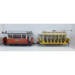 A Bachmann San Francisco trolley or train car plus a LGB train/trailer carriage