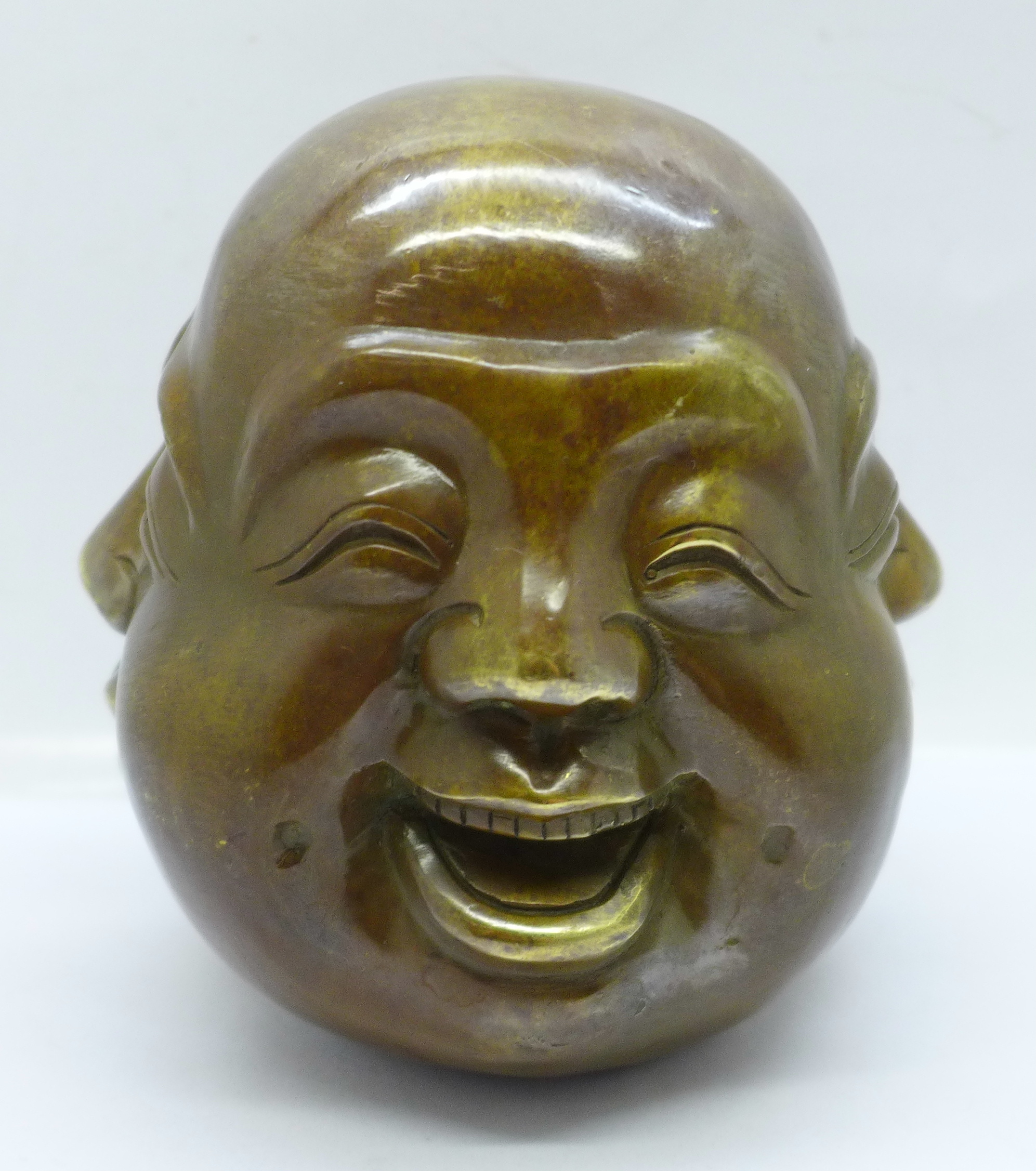 A bronze four-faced Buddha head