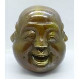 A bronze four-faced Buddha head