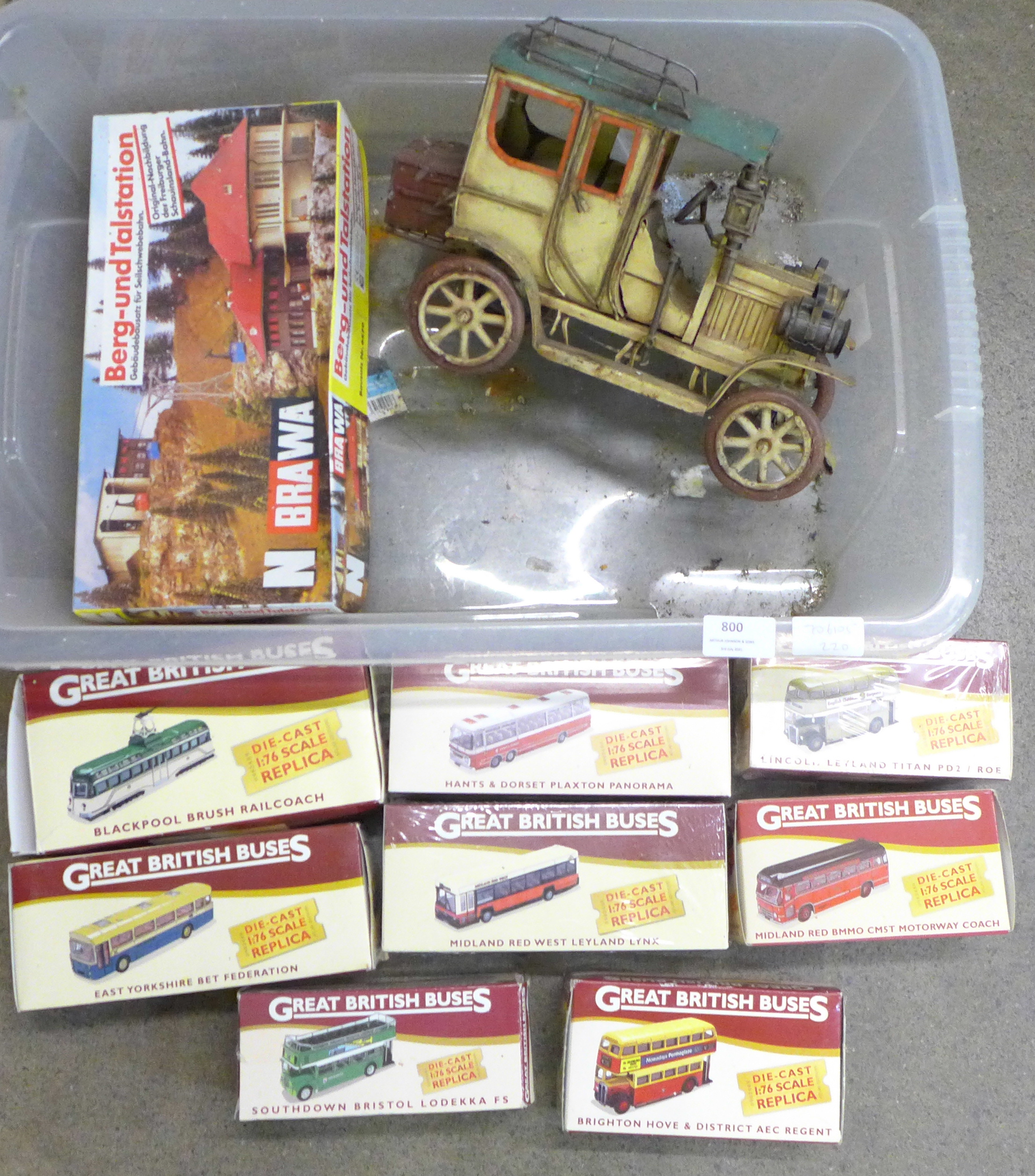 A pressed steel model of a vintage car, eight Great British Buses, boxed and a Brawa Berg-und