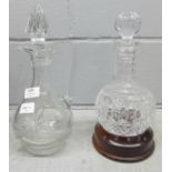 Two cut glass decanters, one with wooden stand **PLEASE NOTE THIS LOT IS NOT ELIGIBLE FOR POSTING