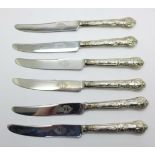 Six silver handled knives