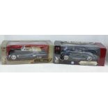 Two die-cast 1:18 scale cars, 1941 Plymouth and a 1949 Cadillac Coupe De Ville, boxed