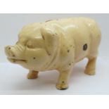 A metal money box in the form of a pig, 21cm