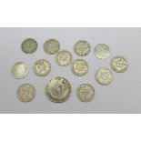 Twelve silver threepence coins and one silver shilling (ten pre-1947, two pre-1920)