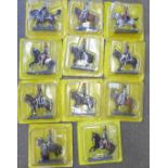 Eleven Cassandra model series figures on horseback sealed in their original blister packs