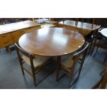 A teak drop-leaf table and four chairs