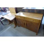 An Art Deco oak two piece dining suite (draw-leaf dining table and sideboard)