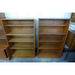 A pair of teak open bookcases