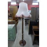 A mahogany standard lamp