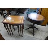 A mahogany drum shaped occasional table and a mahogany nest of tables