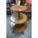 A George III mahogany three tier circular dumb waiter