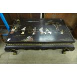 An oriental chinoiserie ebonised coffee table (lacking glass )