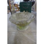 A concrete garden urn