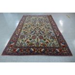 A large cream ground geometric patterned rug