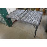 A cast metal garden table