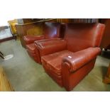 A pair of Art Deco red leather armchairs