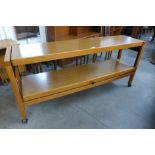 A teak metamorphic trolley/diner and pair of benches