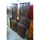 Two mahogany freestanding corner cabinets