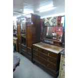 A carved oak two piece bedroom suite