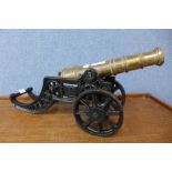 A cast iron and brass miniature cannon