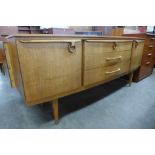 A Beautility teak bow front sideboard