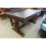 A 17th Century style carved oak draw leaf refectory table