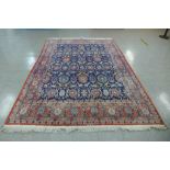 A large blue ground geometric patterned rug